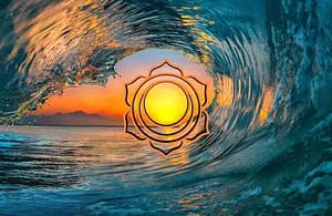 sacral chakra symbol, orange circles with flower like petals, over top of a sunset through a wave in the ocean. sacral chakra awakening symptoms