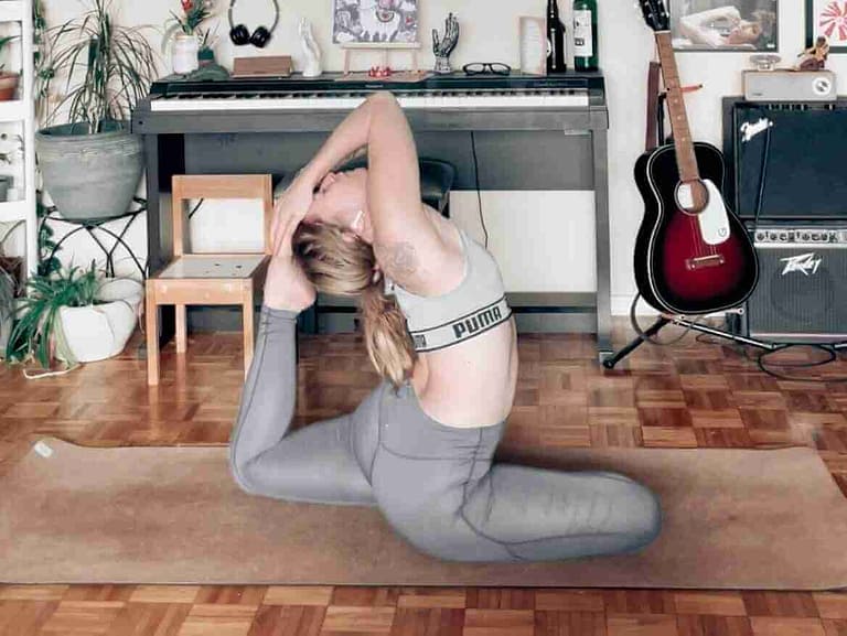 Yoga Teacher Melissa, a Caucasian female teaching yoga online from her home
