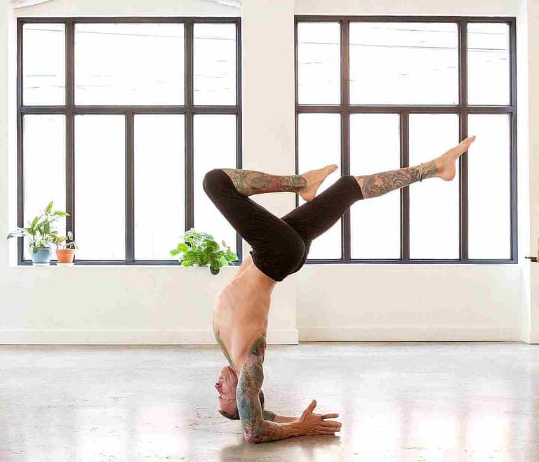 Risto Duggan teaching an arm balance to an online yoga class